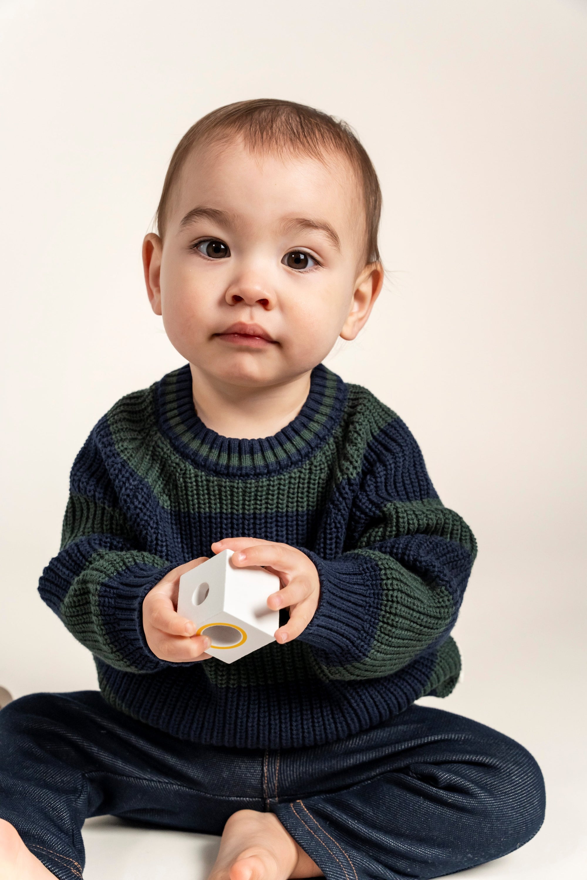 Cozy Navy &amp; Forest Green Striped Knit Jumper for toddlers, made from soft, breathable cotton. Ideal for layering during cooler seasons, offering warmth and a classic style for everyday comfort.