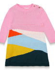 Serenity Skies Cotton Knitted Sweater Dress features pink long sleeves and vibrant geometric patterns in blue, yellow, orange, and green. Soft, cozy cotton perfect for toddlers' casual fall/winter outfits.