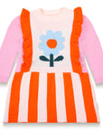 Petal Playtime Cotton Knitted Dress features vibrant pink sleeves, orange stripes, ruffled details, and a bold blue flower design. Soft, cozy, and long-sleeved, perfect for toddlers' fall/winter outfits.