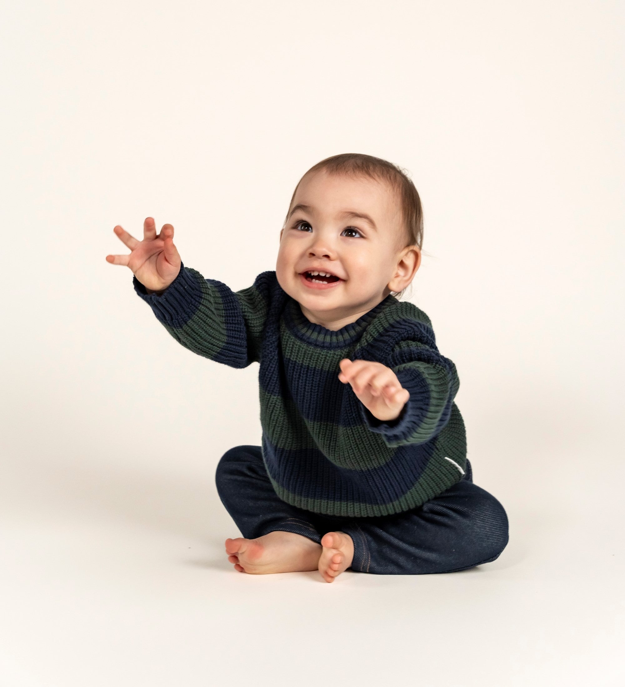 Adorable Navy &amp; Forest Green Striped Knit Jumper crafted from soft cotton, perfect for keeping your little one cozy. Featuring bold stripes and a comfortable fit, ideal for fall and winter layering.