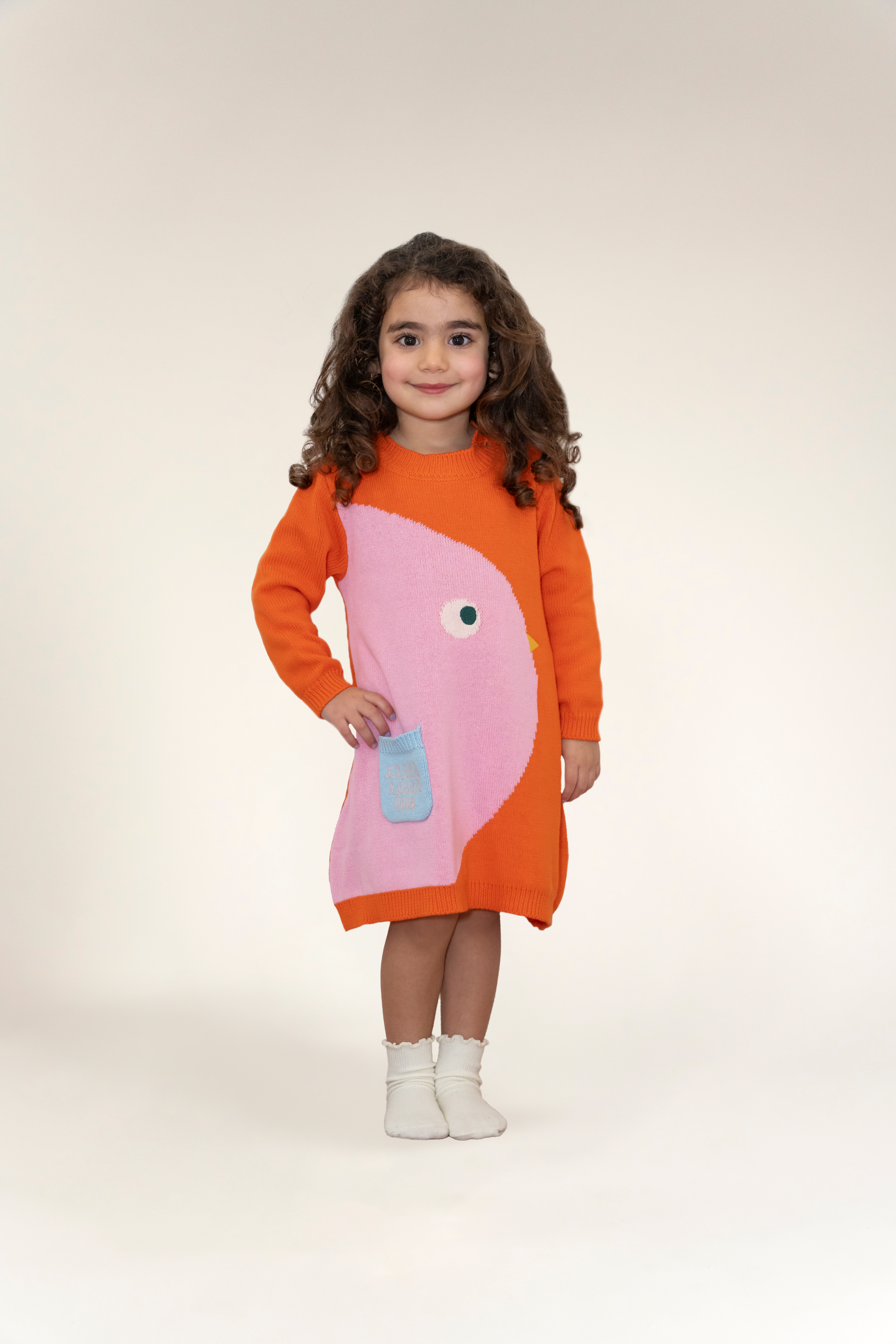 Chirpy Bird Cotton Knitted Sweater Dress for toddlers features vibrant orange and pink colors with a cute bird design, long sleeves, and a soft fabric ideal for fall. Perfect cozy outfit for little girls.